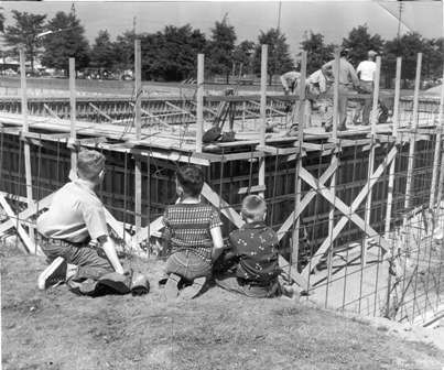 Three youths watch the original Henry Moses pool being built