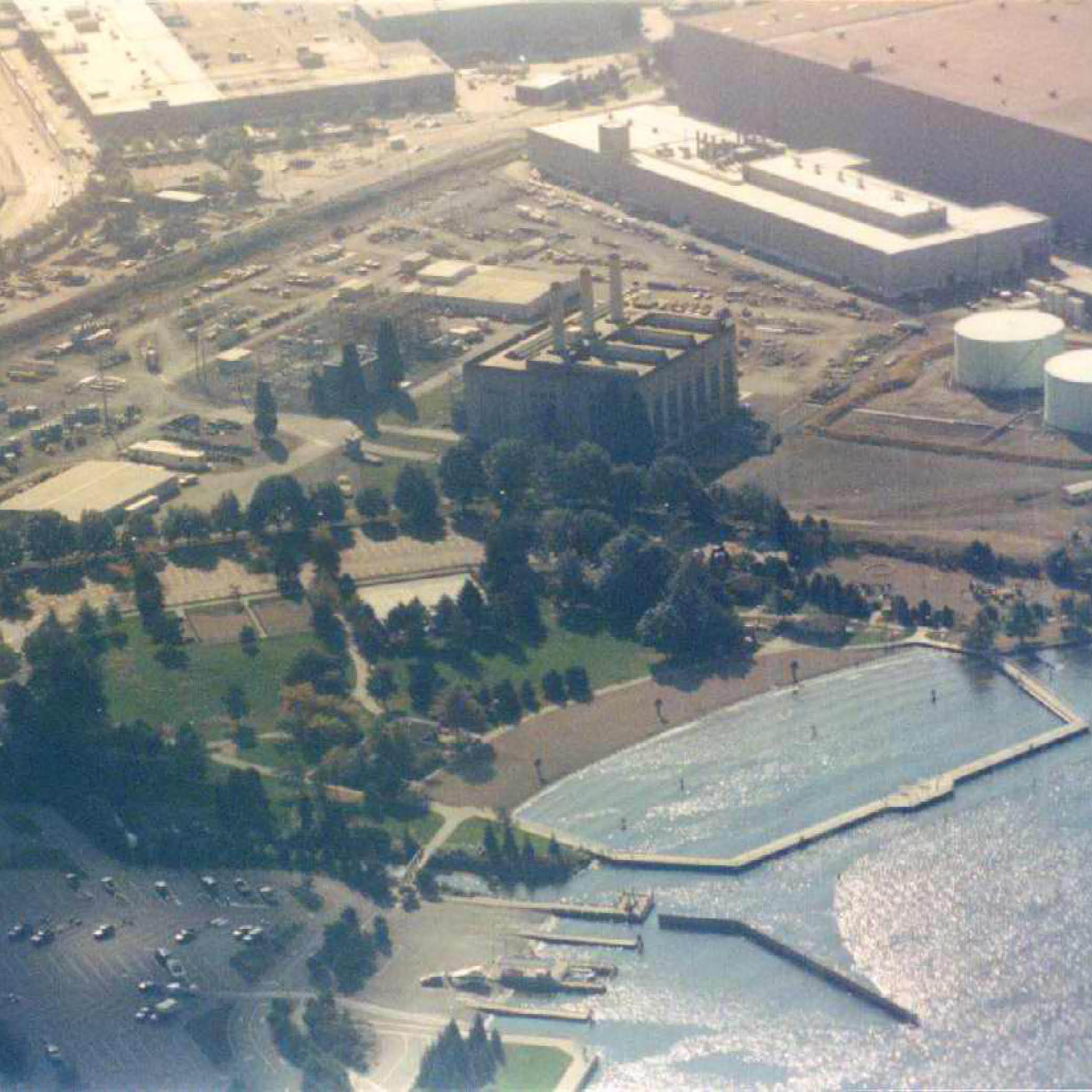 Closeup view of the south section of Gene Coulon Park, Shuffleton Steam Plant and oil tanks, 1992.