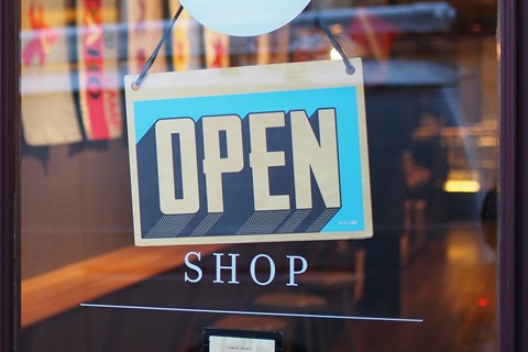 Open for business sign on door